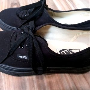 Ladies black on black vans low cut